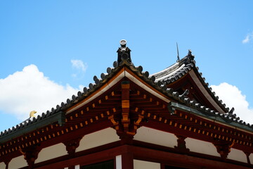 Traditional Japanese Temple Roof Against Clear Blue Sky
