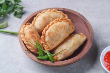 Pastel goreng or chicken and vegetables fried puff is one of the very famous Indonesian snacks
