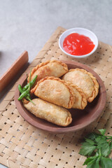 Pastel goreng or chicken and vegetables fried puff is one of the very famous Indonesian snacks
