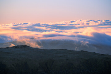 cloud inversion seen from Helvellyn summit in The Lake District mountains, UK.