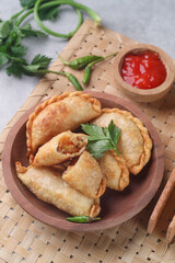 Pastel goreng or chicken and vegetables fried puff is one of the very famous Indonesian snacks
