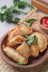Pastel goreng or chicken and vegetables fried puff is one of the very famous Indonesian snacks

