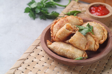 Pastel goreng or chicken and vegetables fried puff is one of the very famous Indonesian snacks
