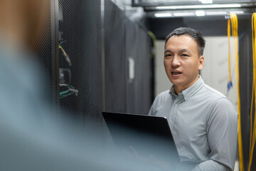 asian engineer working in database