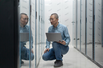 asian engineer working in database