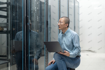 asian engineer working in database