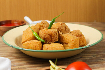 Crispy Fried Tofu with Chili Garnish: A Delicious Indonesian Snack