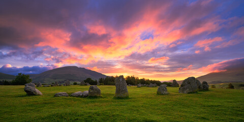 Obraz premium Dramatic summer sunrise over Castlerigg Stone Circle in The Lake District, UK.