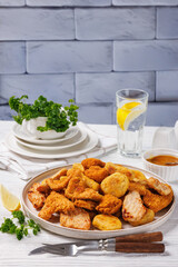 fried chunks, bites, tenders, nuggets on a plate