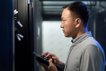 asian engineer working in database