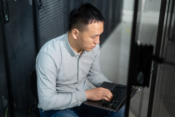 asian engineer working in database