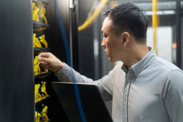 asian engineer working in database