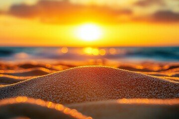 Beautiful sunset over the sea, a sandy beach with waves and clouds in the sky