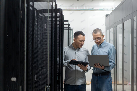 asian engineer working in database - Powered by Adobe