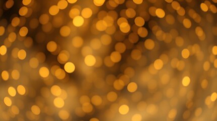 Abstract bokeh background of blurred golden lights creating a warm, festive atmosphere. Soft focus effect.