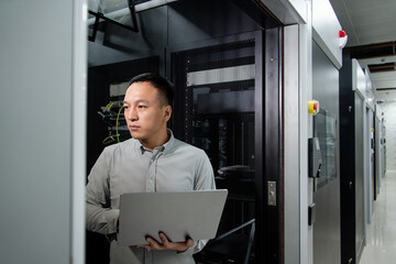 asian male engineer working in database