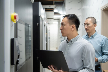 asian male engineer working in database