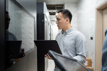 asian male engineer working in database