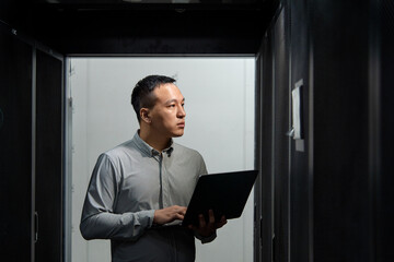 asian male engineer working in database