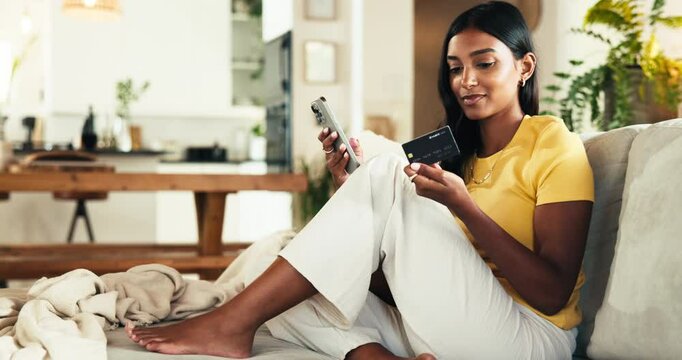 Phone, banking and woman in home with credit card for online shopping, purchase and discount sale. Password, relax and Indian girl on mobile for fintech app with rewards, voucher code and savings