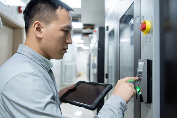 asian male engineer working in database