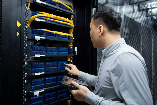 asian male engineer working in database