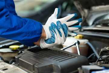 Engineer worker with accident at auto service.Worker with injury from car working