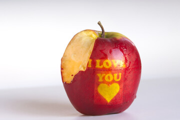 A bitten apple with the words 