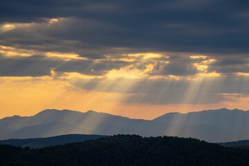 Sunbeams Over Mountain Range
