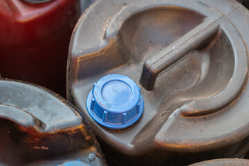 Used engine oil or hydraulic motor oil gallon that keep at the chemical store area. Industrial...