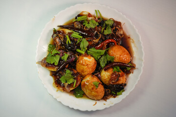 A favorite food for Thai people is Kai Luk Khoi, which is made by frying boiled eggs and sprinkling them with caramel.