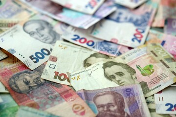 Big amount of different ukrainian hryvnia currency money bills in pile
