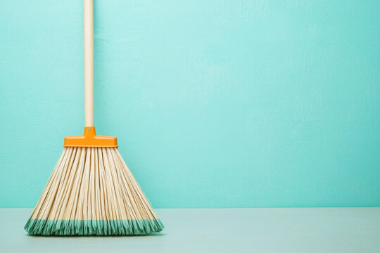 Clean broom stands ready for tidy up, optimistic for chores ahead