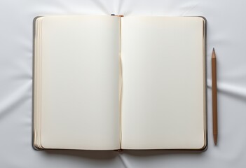 Blank open notebook with a pencil resting beside it on a white surface perfect for creative writing and journaling