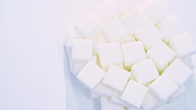 High angle view rotation of sugar lumpy close-up