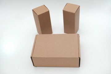 Set of plain brown cardboard boxes in different sizes on a white background, ideal for packaging, shipping, and storage.