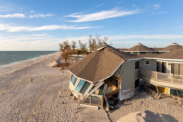 Destroyed houses on ocean shore after hurricane Milton landfall. Natural disaster consequences on...