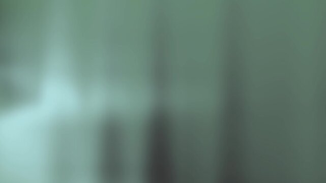 Blurred teal and gray gradient background suitable for various design projects like presentations, websites, and social media graphics. Ideal for modern concepts.
