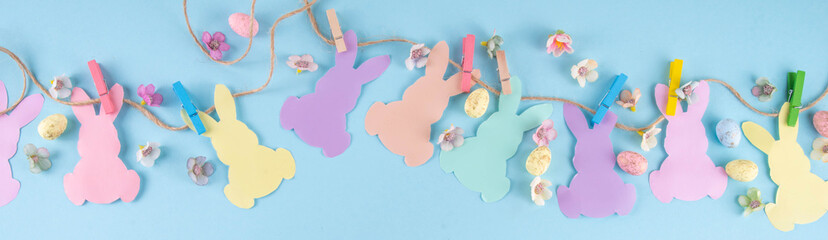 Easter background with paper bunnies garland © ricka_kinamoto