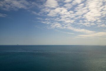 long-exposed view of the sea and clouds