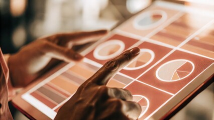 Closeup of a holographic budget breakdown visual with colorful pie charts that animate as a financial manager adjusts forecast parameters with their fingers.