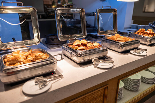 Buffet counter with fresh pastries in the hotel