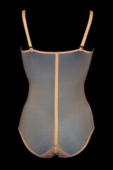 Women's bodysuit in flesh color on a black background.