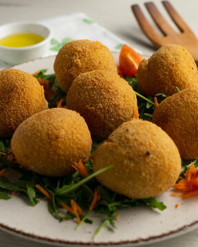 Spanish ham croquettes on a bed of rocket