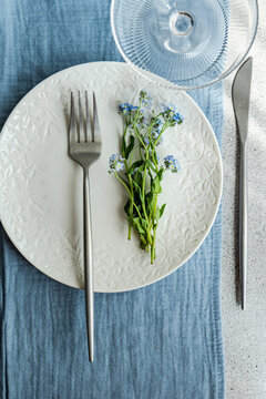 Spring table decoration with forget-me-not flowers