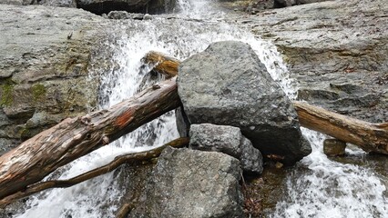 Picturesque mountain river cascading through rocky terrain creates breathtaking landscape Clear water flows dynamically creating serene natural landscape Nature shots showing stunning river scenery