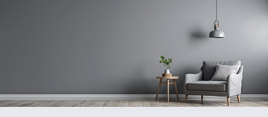 Modern gray living room with minimalist decor, armchair, side table, hanging lamp, and empty wall.