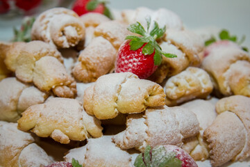  Close up of puff pastry with strawberry on top. Selective focus
