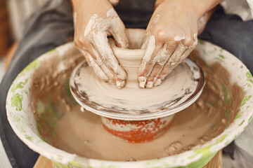 Young couple at artwork in pottery