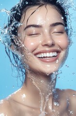 A beautiful woman smiling with water splashes around her face